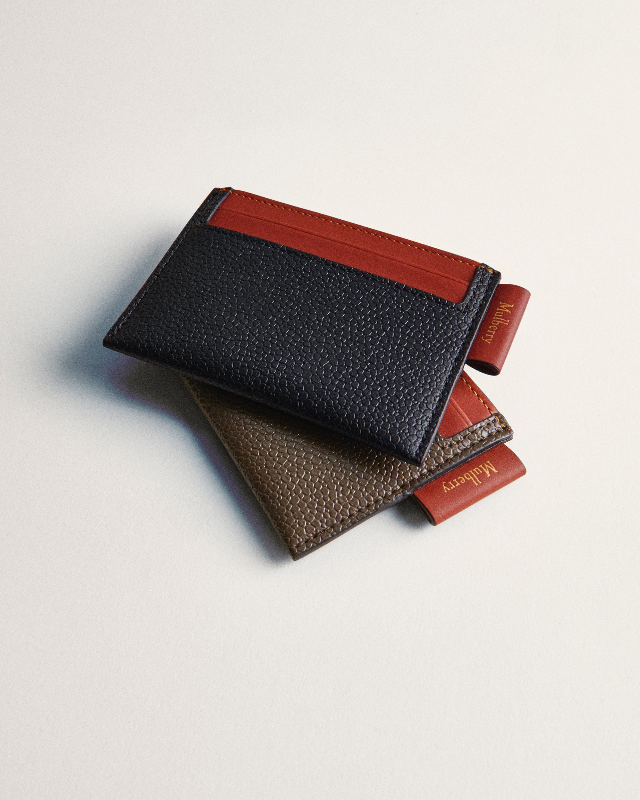 Two Mulberry credit card slips in black and brown leather